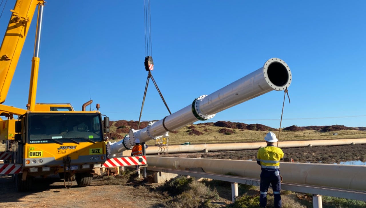 Crane lifting a pipeline spool